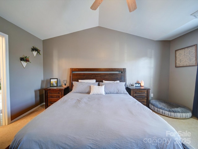 carpeted bedroom featuring ceiling fan and vaulted ceiling