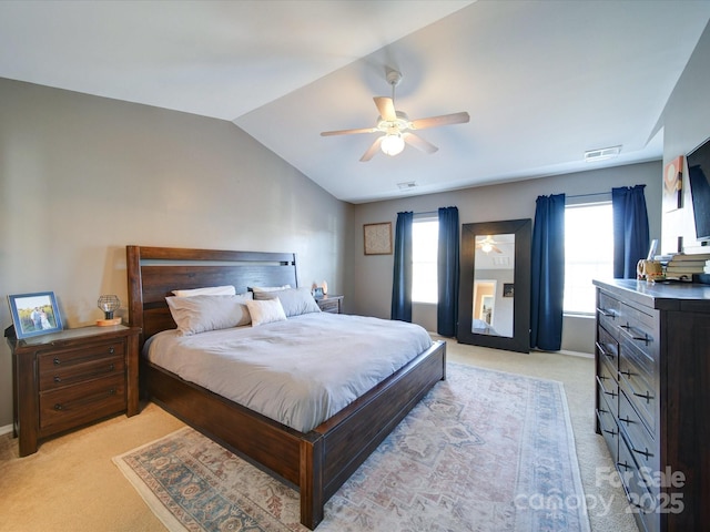 bedroom with ceiling fan, light carpet, and lofted ceiling