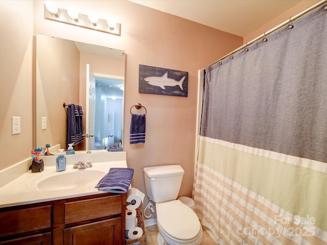 bathroom with toilet and vanity