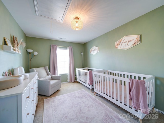 carpeted bedroom with sink and a crib