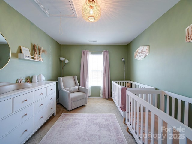 carpeted bedroom with a crib