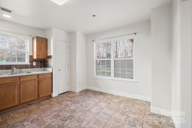 kitchen with decorative backsplash and sink