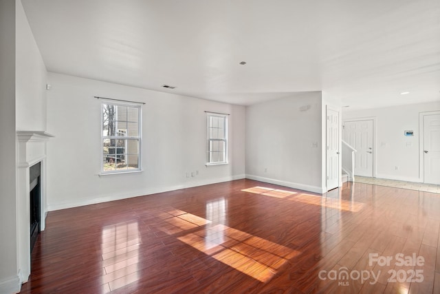 unfurnished living room with hardwood / wood-style floors