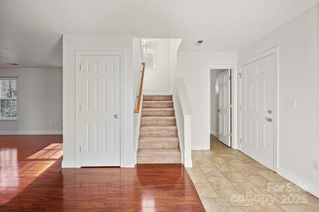 foyer entrance with light hardwood / wood-style flooring