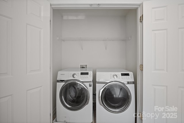 laundry room featuring washing machine and clothes dryer