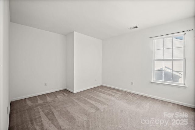 unfurnished room featuring carpet flooring