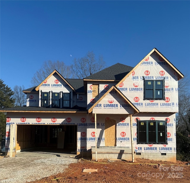 view of front facade featuring crawl space, driveway, and an attached garage