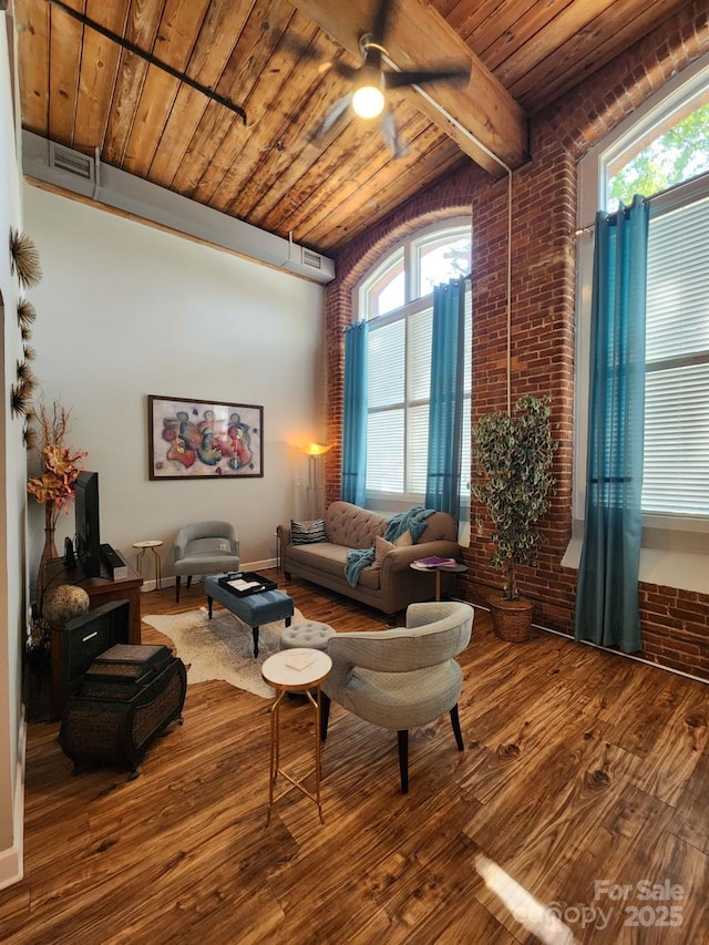 living room with brick wall, wood-type flooring, ceiling fan, and wood ceiling