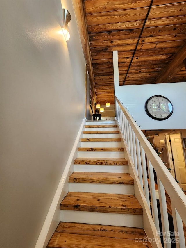 stairs with wood ceiling and wood-type flooring