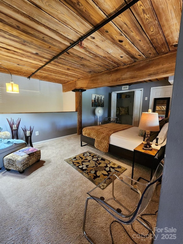 bedroom with wooden ceiling and carpet floors