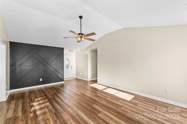 unfurnished living room featuring hardwood / wood-style flooring, ceiling fan, and lofted ceiling