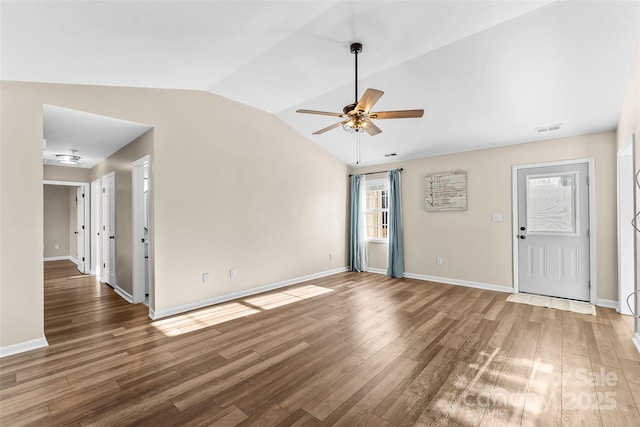 spare room featuring ceiling fan, lofted ceiling, and wood-type flooring