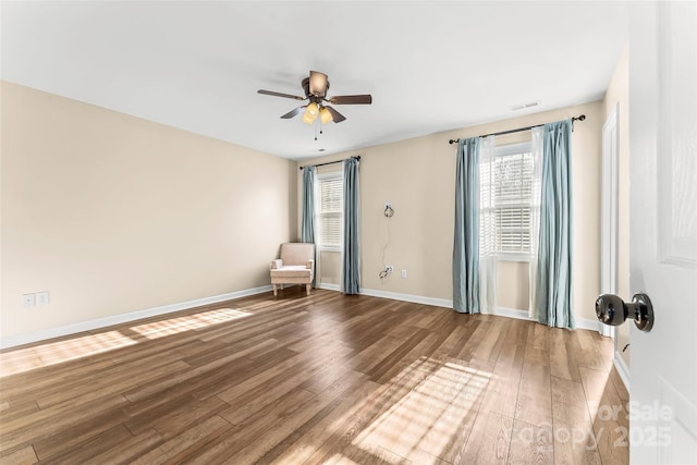 unfurnished room with hardwood / wood-style floors and ceiling fan