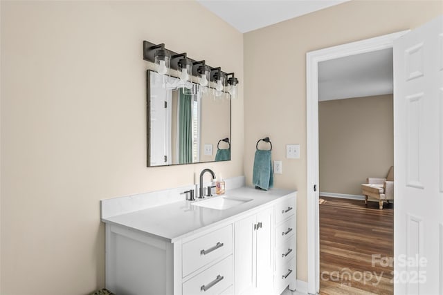 bathroom featuring vanity and hardwood / wood-style floors