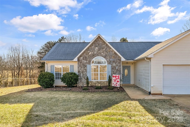 ranch-style house with a garage and a front yard