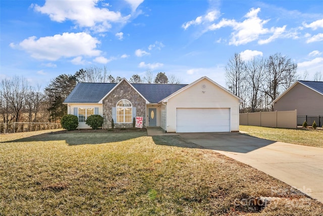 single story home with a garage and a front yard