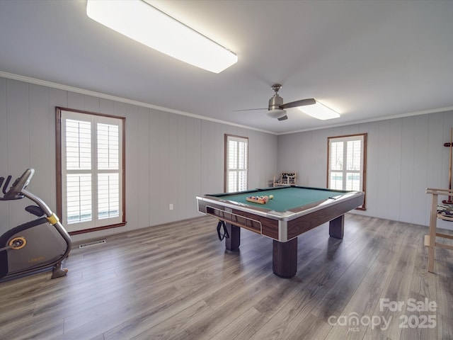 game room featuring ceiling fan, pool table, ornamental molding, and hardwood / wood-style floors