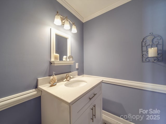 bathroom with crown molding and vanity