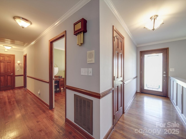 corridor featuring crown molding and hardwood / wood-style floors