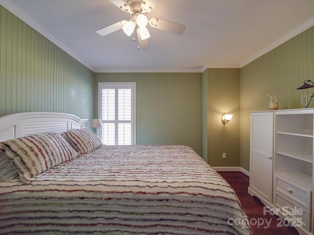 bedroom with dark wood-type flooring, ceiling fan, and crown molding