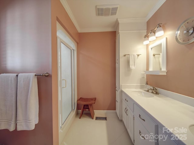 bathroom with crown molding, tile patterned floors, vanity, and a shower with door