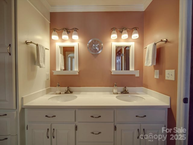 bathroom featuring vanity and crown molding