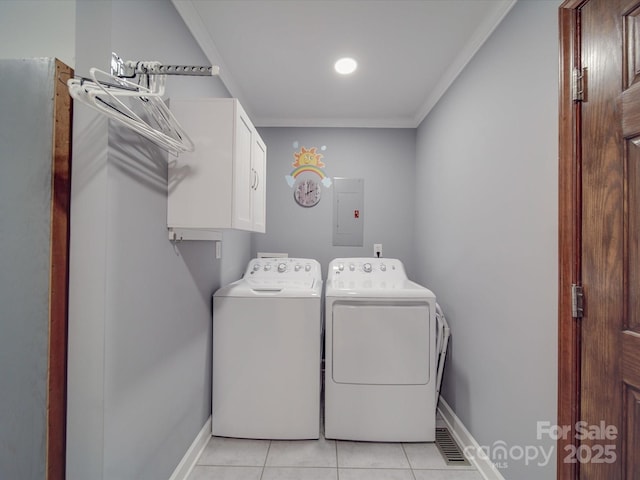 clothes washing area featuring light tile patterned floors, crown molding, electric panel, cabinets, and washing machine and clothes dryer