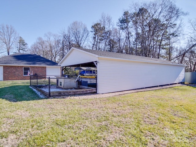 exterior space featuring a yard and a carport