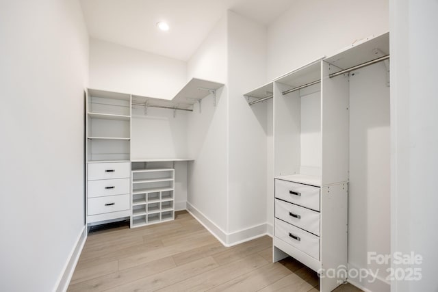 walk in closet featuring light wood-style floors