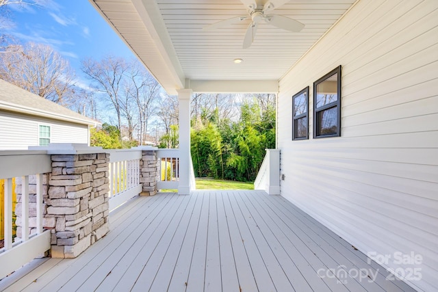 wooden terrace with a ceiling fan