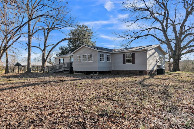 exterior space with a deck and cooling unit