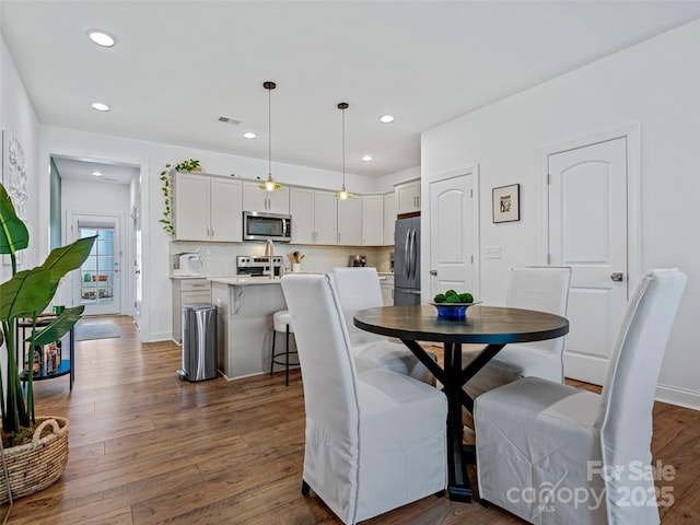 dining room featuring dark wood-type flooring