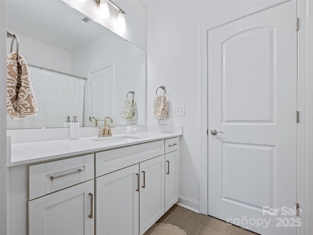 bathroom featuring vanity and tile patterned flooring