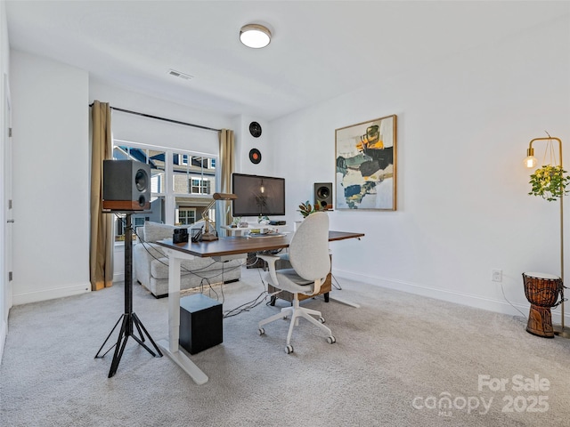 home office with light colored carpet