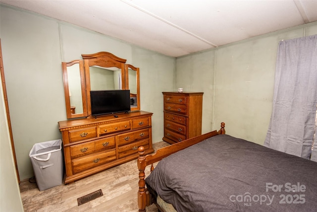 bedroom with light hardwood / wood-style flooring