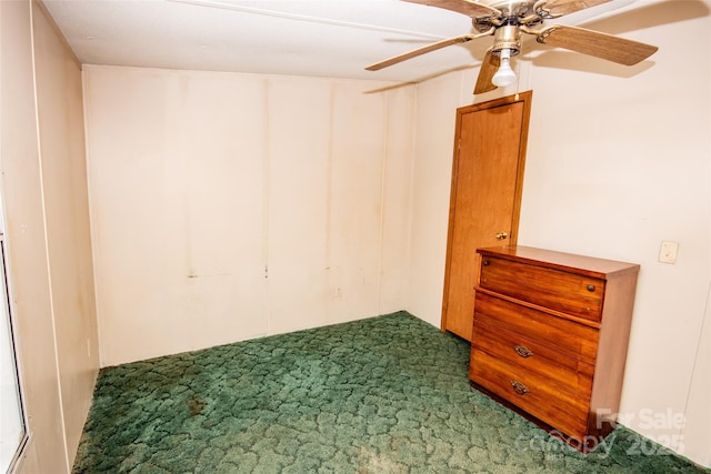 empty room with carpet floors and ceiling fan