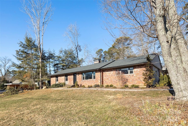 ranch-style home featuring a front yard