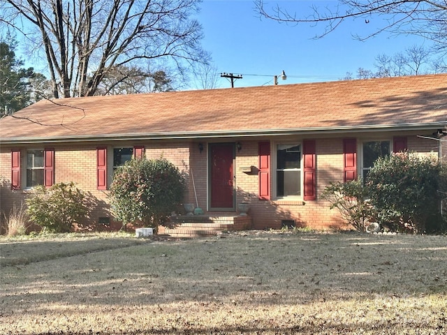 ranch-style house with a front yard