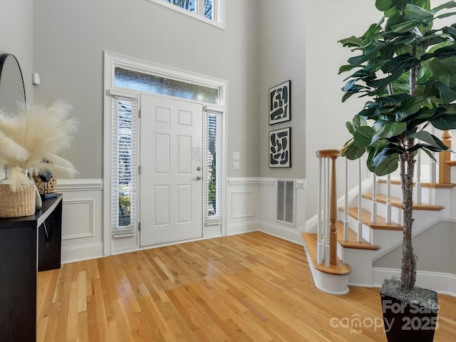 entryway with plenty of natural light and hardwood / wood-style floors