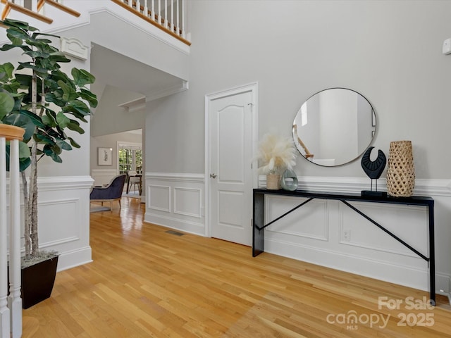 foyer entrance with light hardwood / wood-style flooring