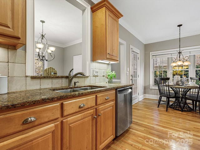 kitchen featuring light hardwood / wood-style floors, sink, stainless steel dishwasher, and a chandelier