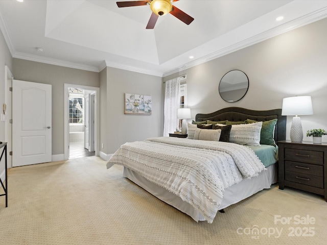 bedroom with ceiling fan, crown molding, light colored carpet, and a raised ceiling