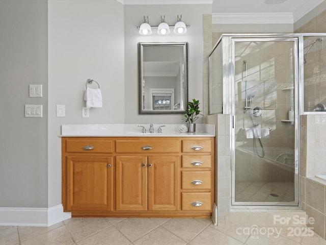 bathroom with ornamental molding, tile patterned floors, vanity, and a shower with shower door