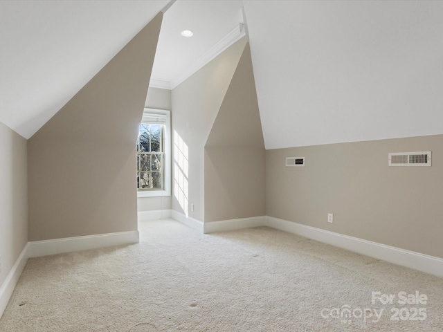 bonus room featuring lofted ceiling and light colored carpet