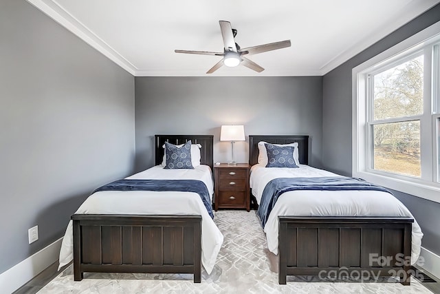 bedroom featuring ceiling fan, crown molding, and multiple windows