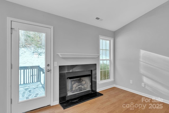 unfurnished living room with hardwood / wood-style floors