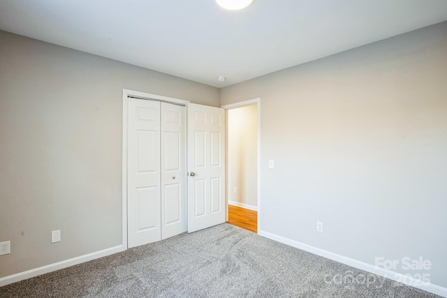 unfurnished bedroom featuring a closet and carpet