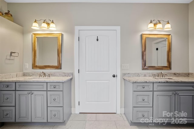 bathroom featuring tile patterned floors and vanity