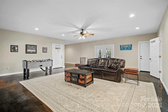 living room with ceiling fan, french doors, and concrete floors