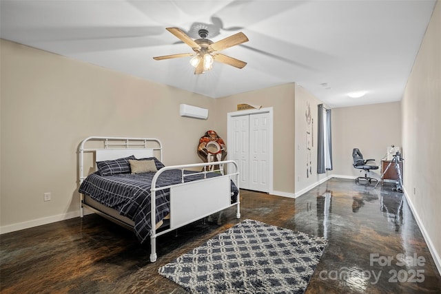 bedroom with ceiling fan, a closet, and a wall unit AC